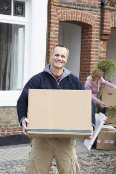 Removal team preparing furniture and boxes for a move in Fulham