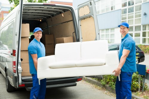 Student removal team handling boxes in a Fulham street with local property access challenges