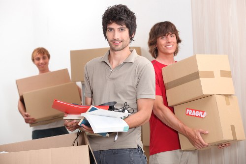 Careful unloading of household items at a new home in Fulham