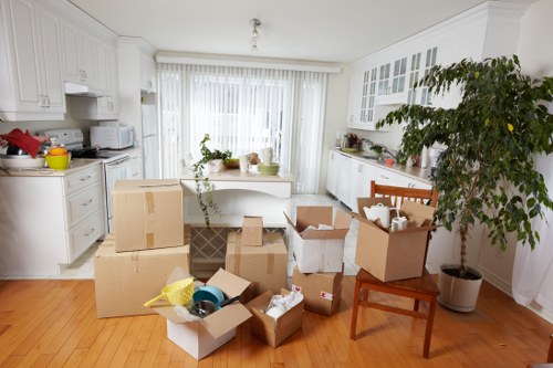 Moving boxes and wrapped furniture ready for transport in Fulham