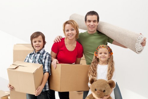 Furniture and boxes being assessed for cubic-yard pricing