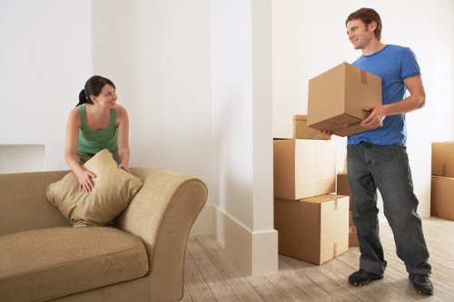 Professional movers handling a flat removal in Fulham with stairs and tight access